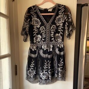 Chic Black Romper with Silver Floral Design